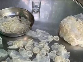 Vietnam police raid condom recycling warehouse